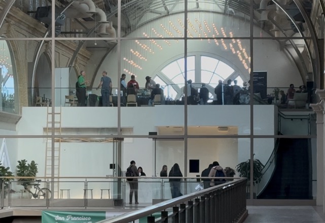 People gathered on two levels of the Ferry Building venue